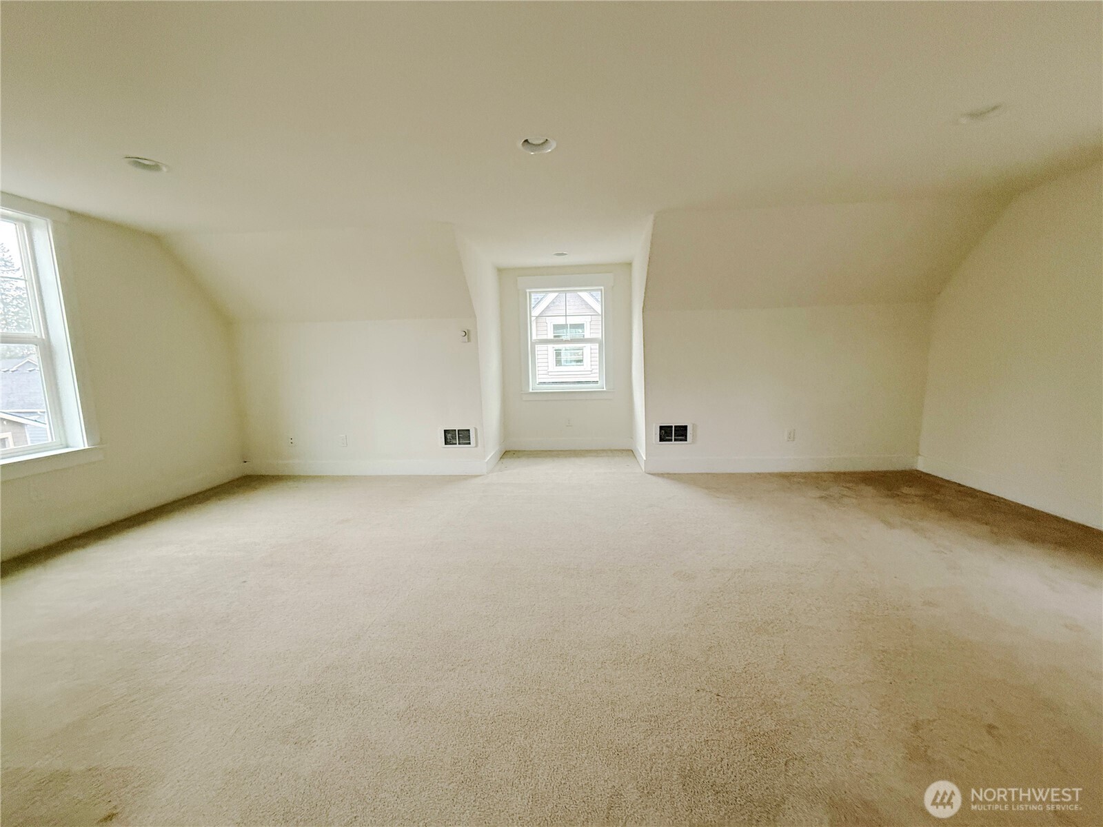 30 East Compass Lane, Unit A98524 Allyn, WA 98524 - Photo 12 of 36 an empty room with a windows and cabinet