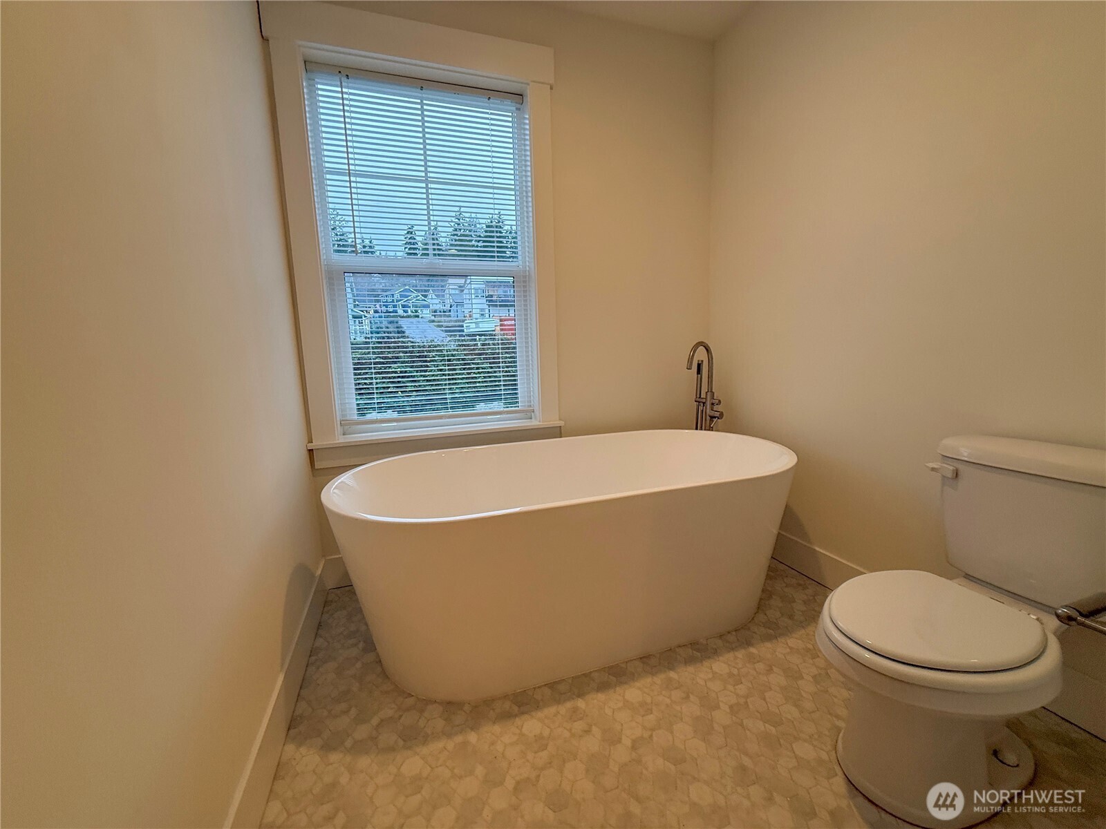 30 East Compass Lane, Unit A98524 Allyn, WA 98524 - Photo 15 of 36 a white bath tub sitting next to a toilet
