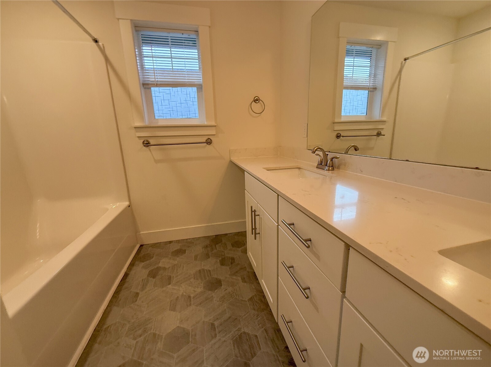 30 East Compass Lane, Unit A98524 Allyn, WA 98524 - Photo 7 of 36 a bathroom with a tub sink and mirror