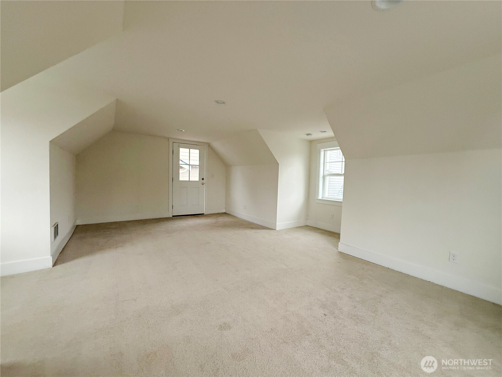 30 East Compass Lane, Unit A98524 Allyn, WA 98524 - Photo 8 of 36 an empty room with windows