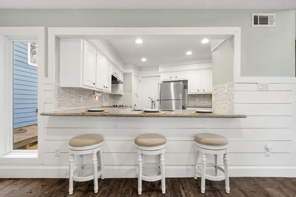a bedroom with a bed and cabinets