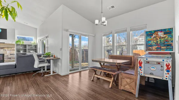 a bedroom with a bed a table and chair
