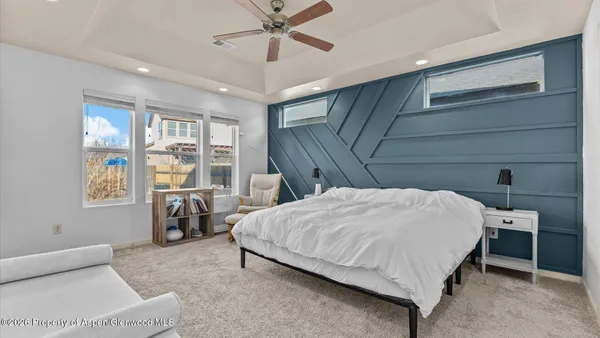 a bedroom with a bed and a mirror