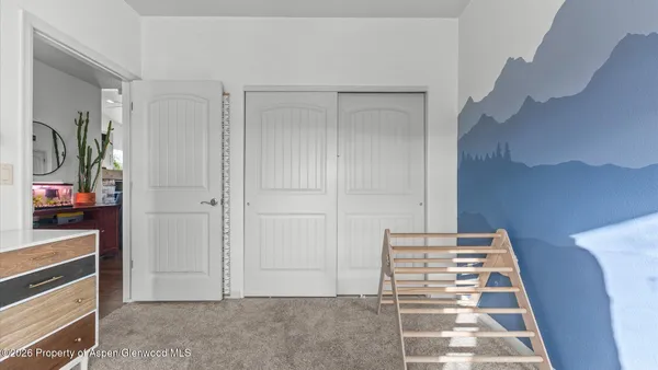 a view of a room with a white walls