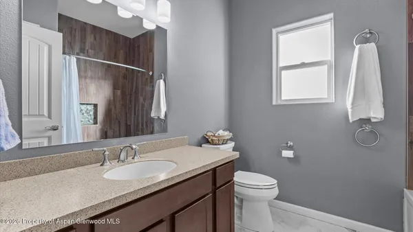 a bathroom with a sink and mirror