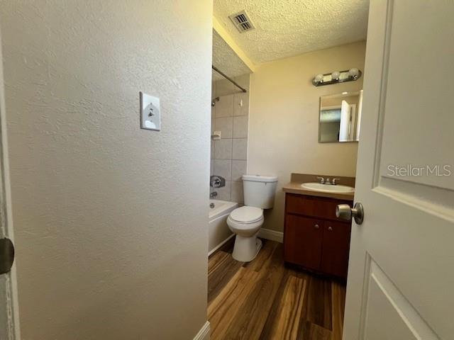 6413 Sutters Mill Road New Port Richey, FL 34653 - Photo 11 of 20 a bathroom with a toilet a sink and mirror