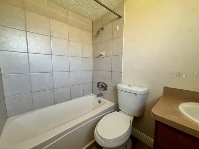 6413 Sutters Mill Road New Port Richey, FL 34653 - Photo 12 of 20 a white toilet sitting next to a bath tub