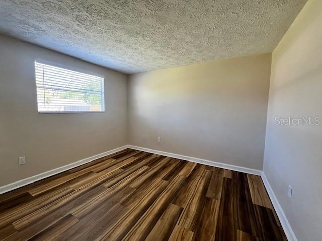 6413 Sutters Mill Road New Port Richey, FL 34653 - Photo 13 of 20 a view of a room with wooden floor and window