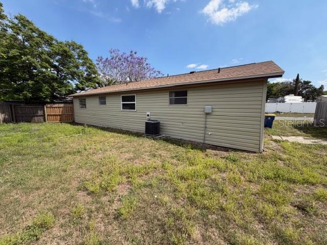 6413 Sutters Mill Road New Port Richey, FL 34653 - Photo 20 of 20 a backyard of a house with lots of green space