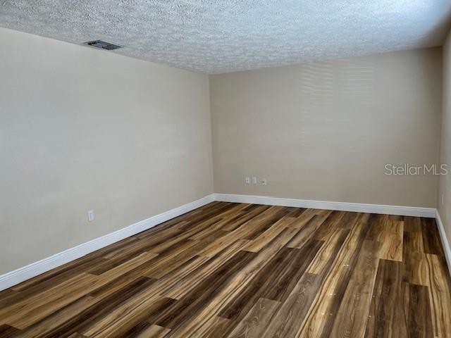 6413 Sutters Mill Road New Port Richey, FL 34653 - Photo 3 of 20 a view of wooden floor