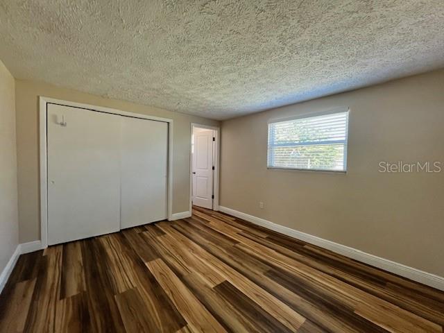 6413 Sutters Mill Road New Port Richey, FL 34653 - Photo 8 of 20 a view of an empty room and wooden floor