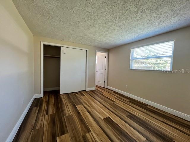 6413 Sutters Mill Road New Port Richey, FL 34653 - Photo 9 of 20 a view of an empty room and wooden floor
