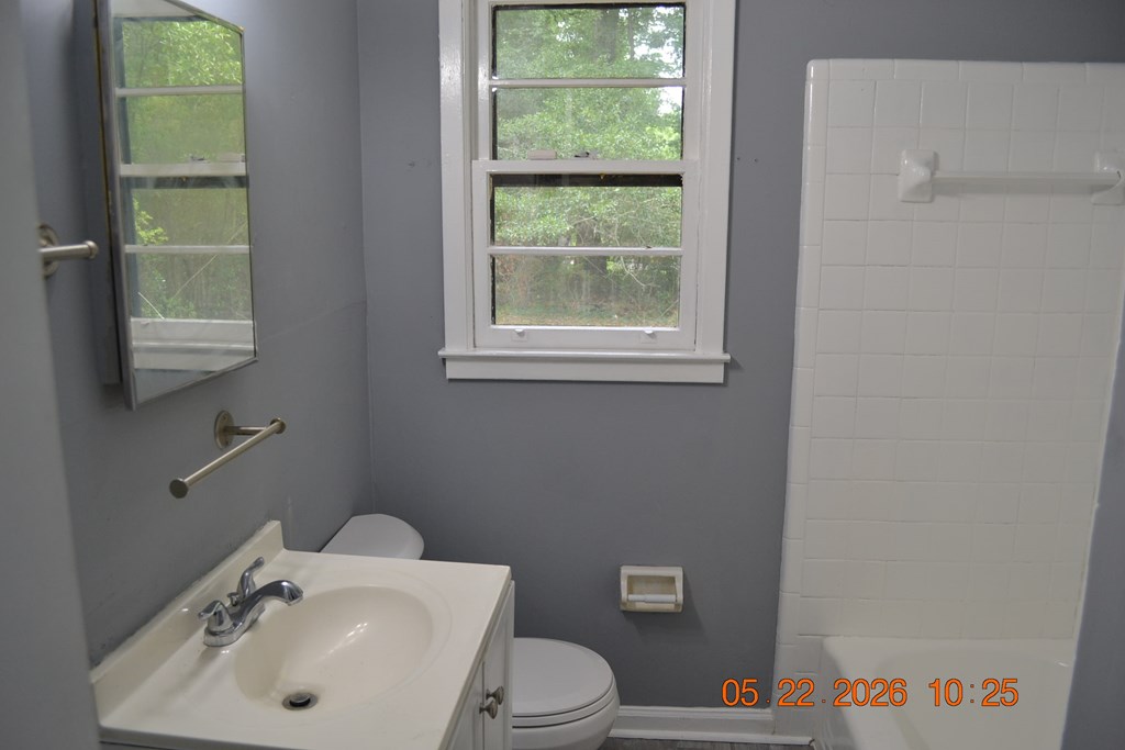 5552 Valleybrook Road Columbus, GA 31907 - Photo 14 of 27 a bathroom with a sink a toilet and a mirror