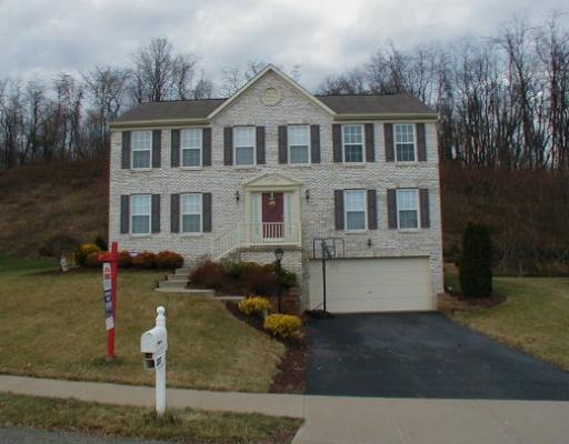 Exterior Front. Brick facade, private rear lot, beautifully landscaped, level driveway, over sized garage and so much more for an outstanding price!!