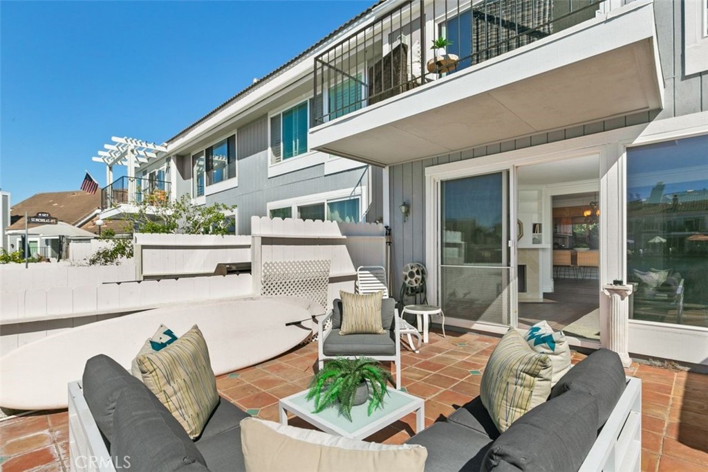 16117 St Croix Circle Huntington Beach, CA 92649 - Photo 13 of 45 a view of a patio with couches table and chairs and potted plants