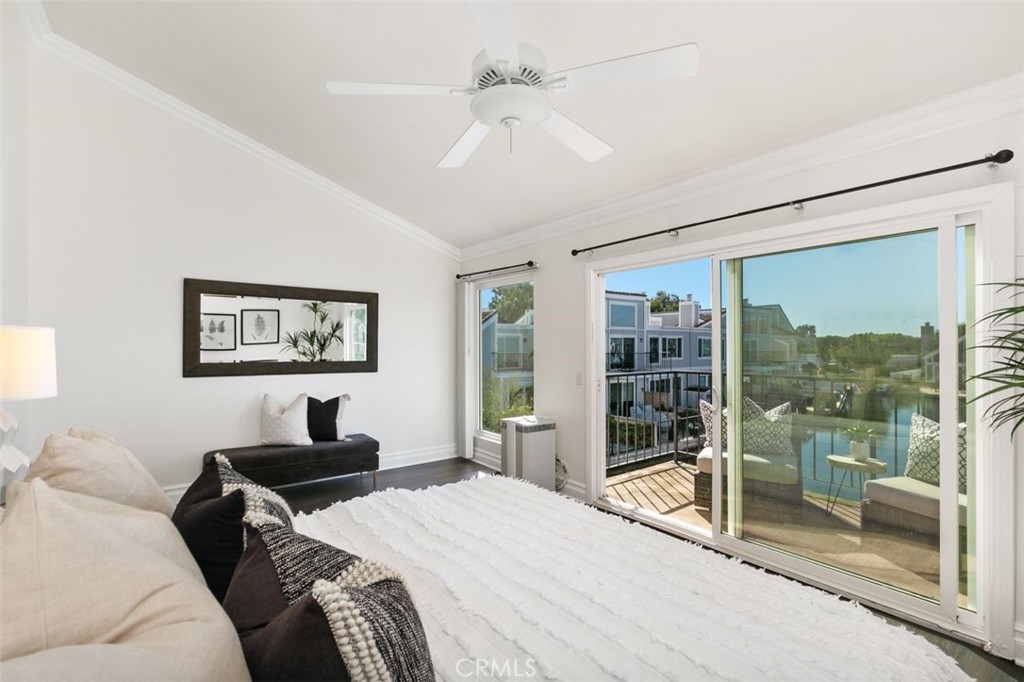 16117 St Croix Circle Huntington Beach, CA 92649 - Photo 28 of 45 a bedroom with a large bed and a window