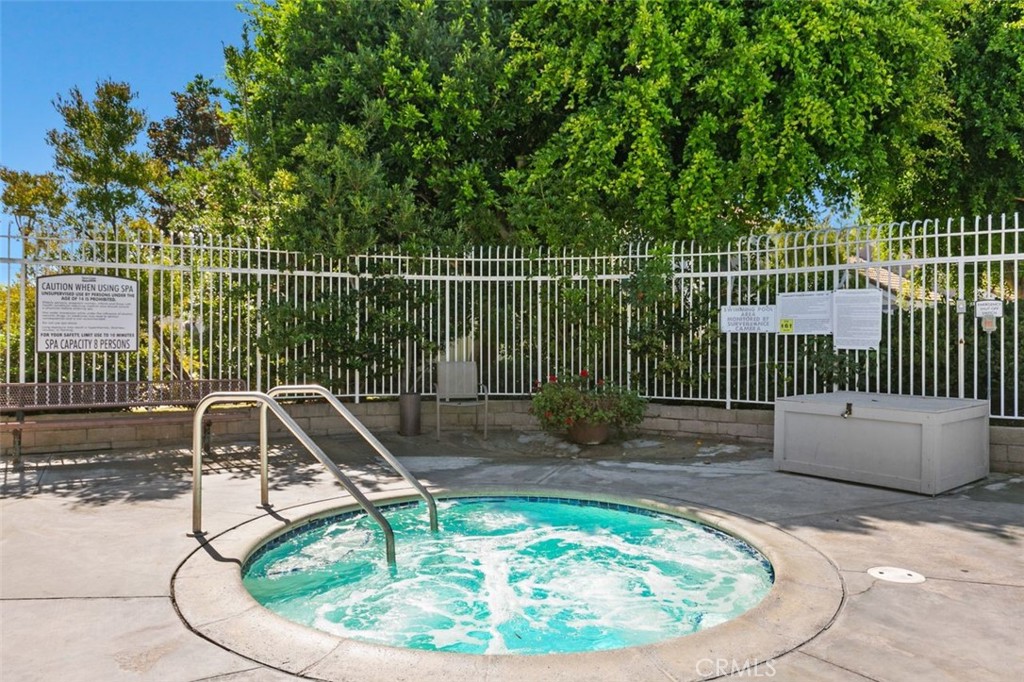 16117 St Croix Circle Huntington Beach, CA 92649 - Photo 38 of 45 a swimming pool with a sitting area