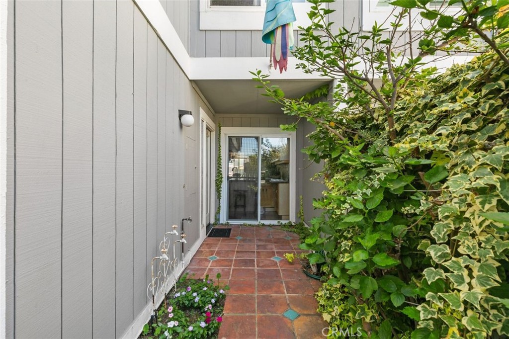 16117 St Croix Circle Huntington Beach, CA 92649 - Photo 4 of 45 a view of a pathway besides a house