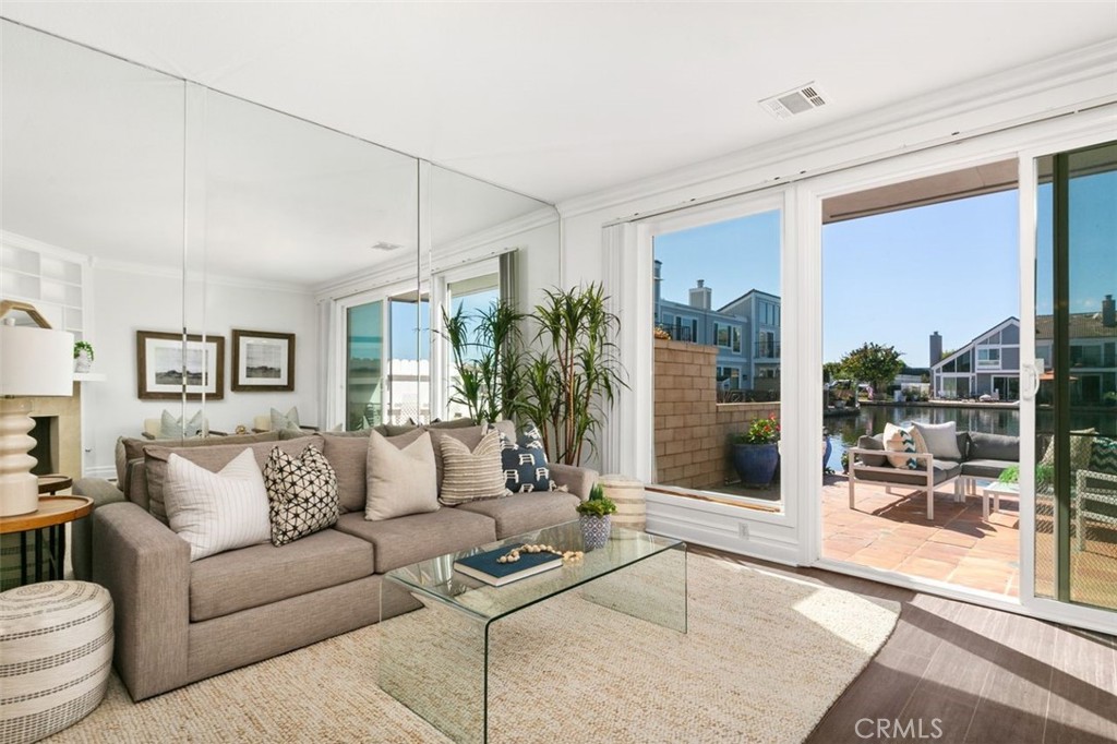 16117 St Croix Circle Huntington Beach, CA 92649 - Photo 7 of 45 a living room with furniture and a glass door