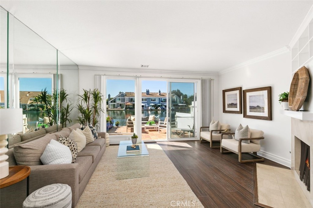 16117 St Croix Circle Huntington Beach, CA 92649 - Photo 8 of 45 a living room with furniture and a large window