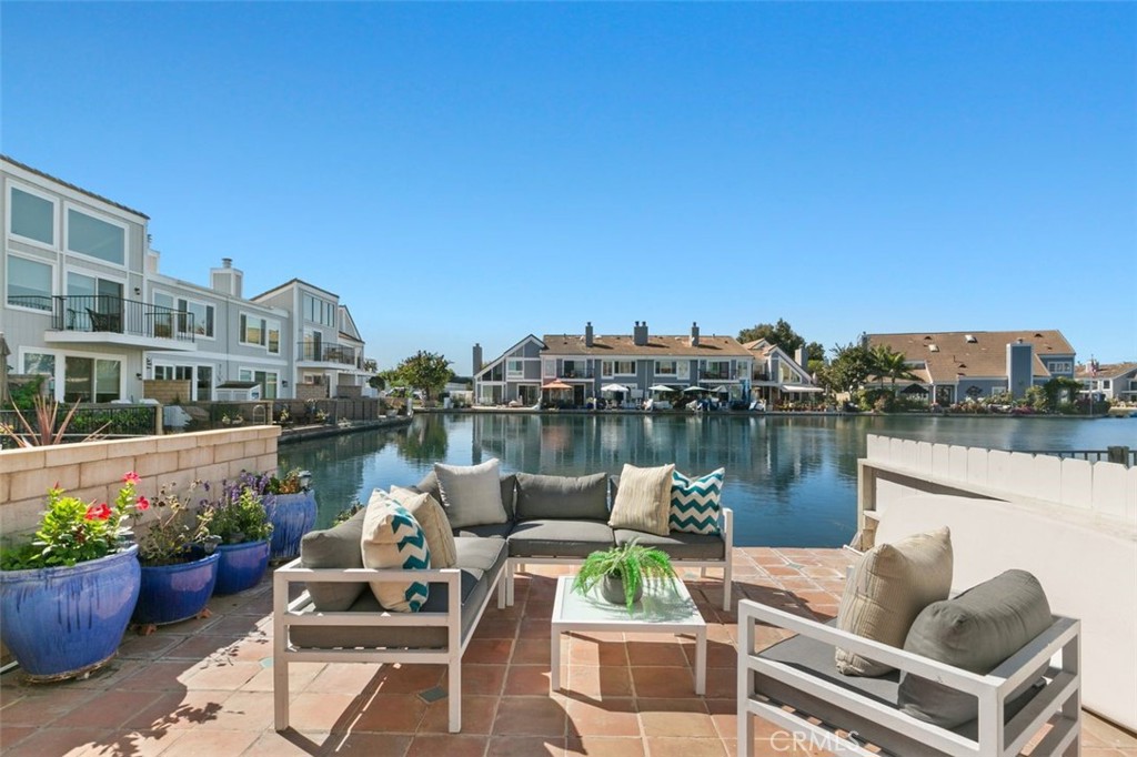 16117 St Croix Circle Huntington Beach, CA 92649 - Photo 9 of 45 a view of a lake with couches and city view