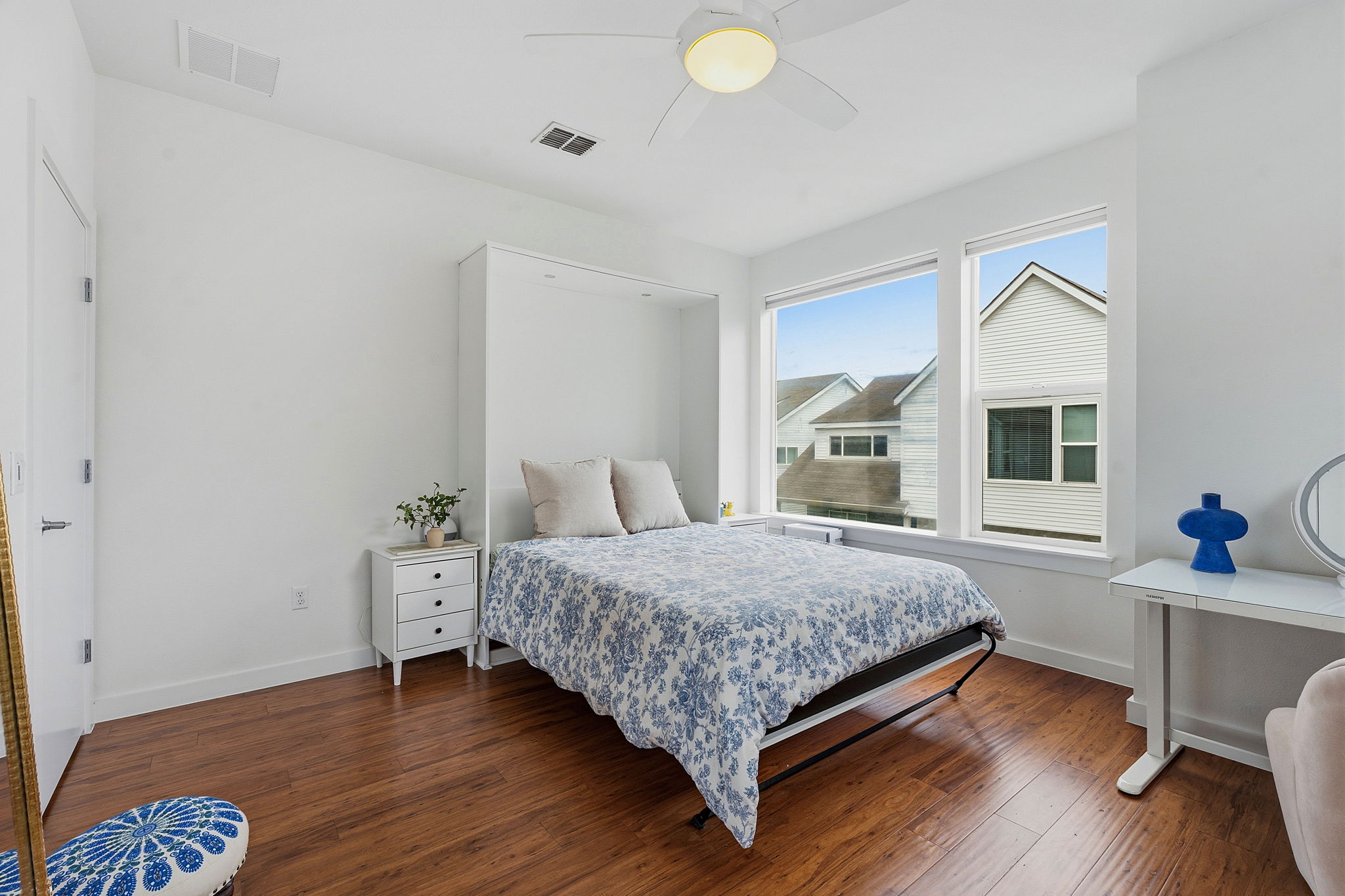 3001 Del Curto Road, Unit 31 Austin, TX 78704 - Photo 25 of 32 a bedroom with a bed and a table in it