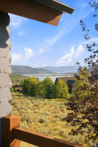 12465 Bone Road Kamas, UT 84036 - Photo 23 of 63 Expansive mountain scenery with a distant lake, surrounded by natural landscaping, and featuring a wood railing