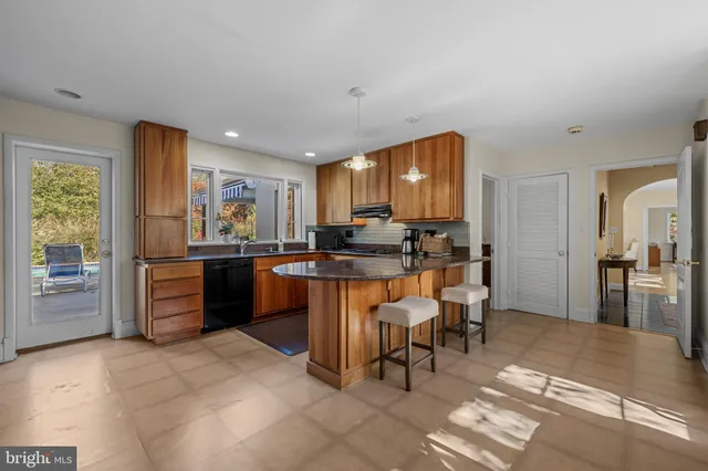 a kitchen with a sink cabinets and counter top space