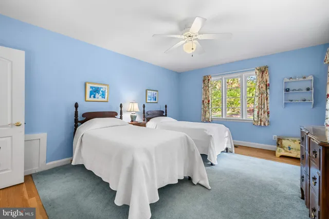 a bed room with a bed and a chandelier