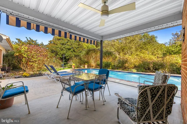 a patio with table and chairs