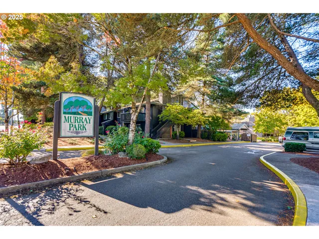 a view of a street with a bench in front of it