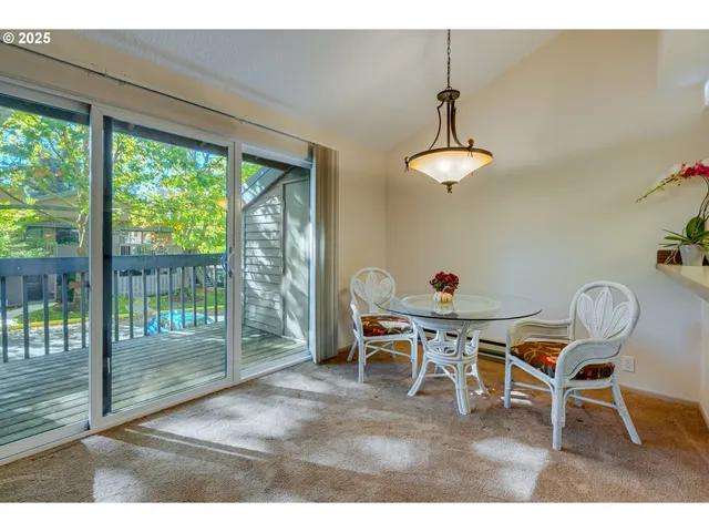 a dining room with furniture window wooden floor