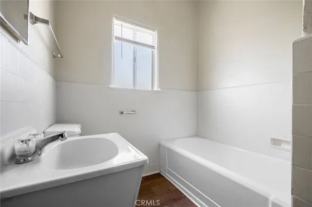 a bathroom with a sink and bathtub