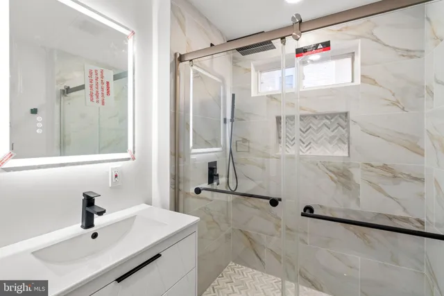 a bathroom with a sink and a shower