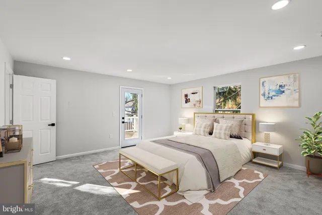 a bedroom with a large bed and a couch