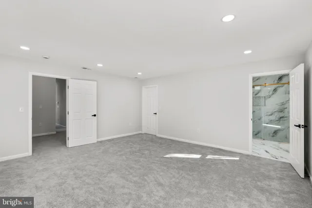 an empty room with a bathroom