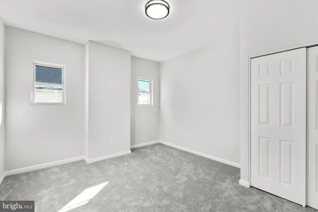 an empty room with windows