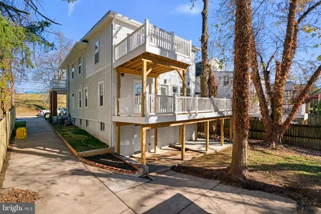 a view of a chairs and a table in the balcony