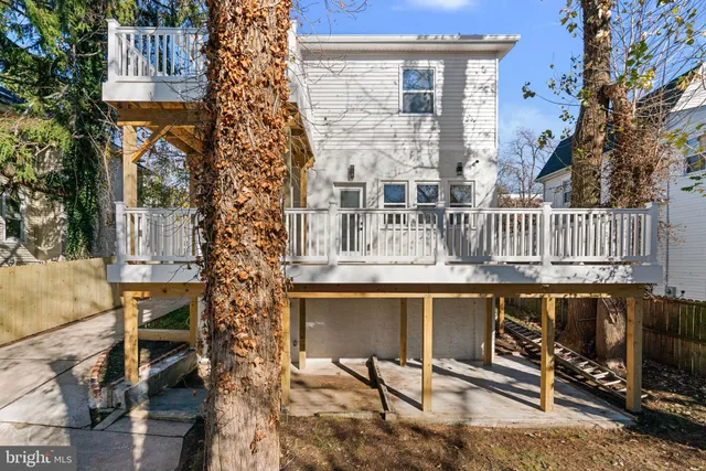 a view of a chairs and table on the balcony