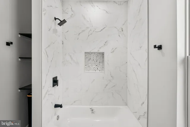 a view of an empty room with a staircase