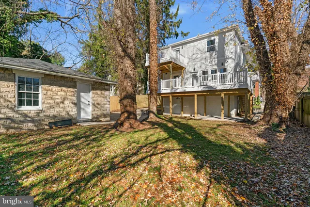 a view of a wooden deck with a yard
