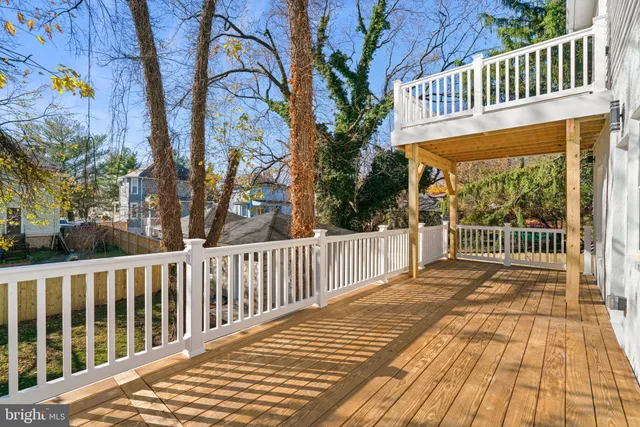 a view of a balcony with wooden floor