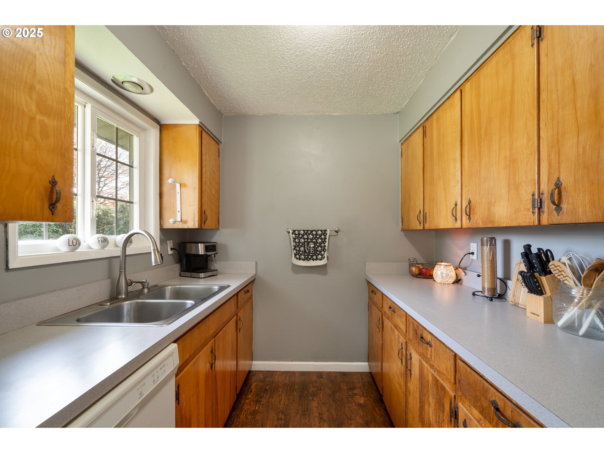 3195 Fitzpatrick Road Tillamook, OR 97141 - Photo 13 of 31 a kitchen with a sink a window and cabinets