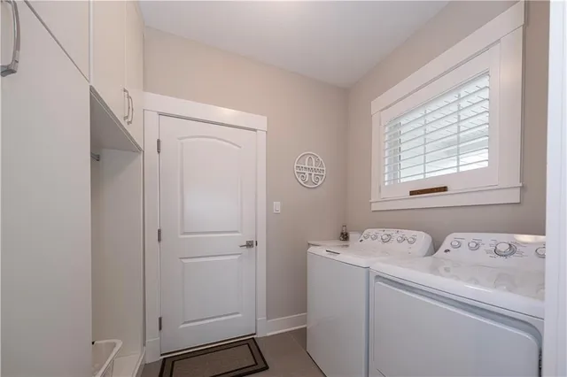 a view of bathroom with a washer and dryer