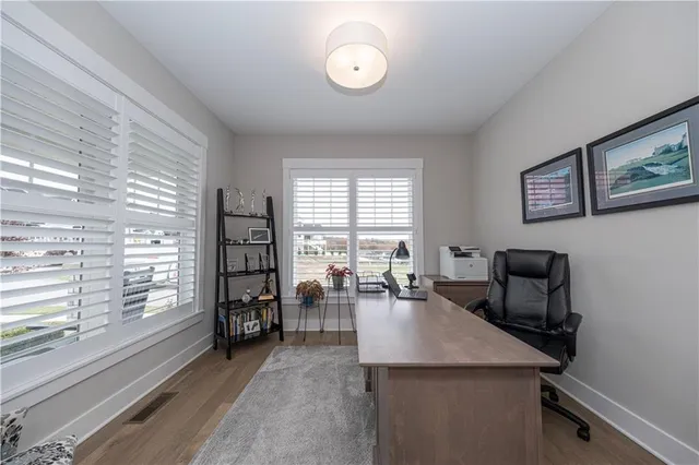 a view of a livingroom with furniture and window