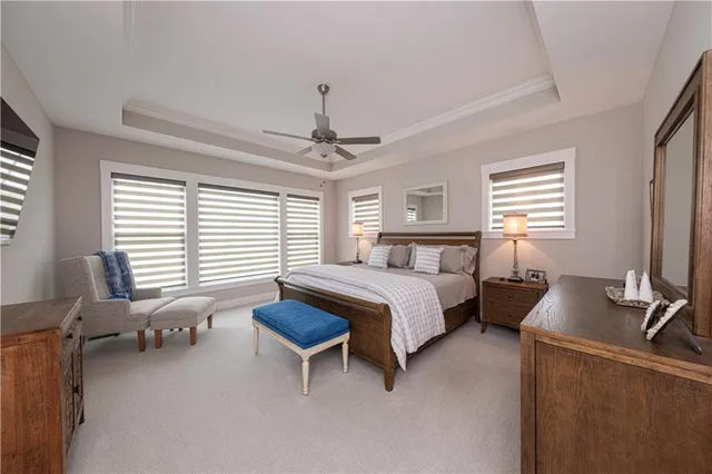 a bedroom with a bed and a desk