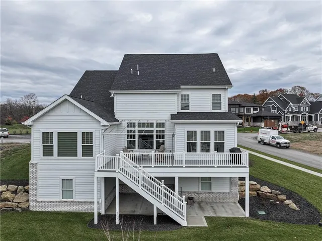 a aerial view of a house with a yard