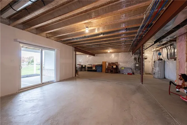 a view of empty room with wooden ceiling