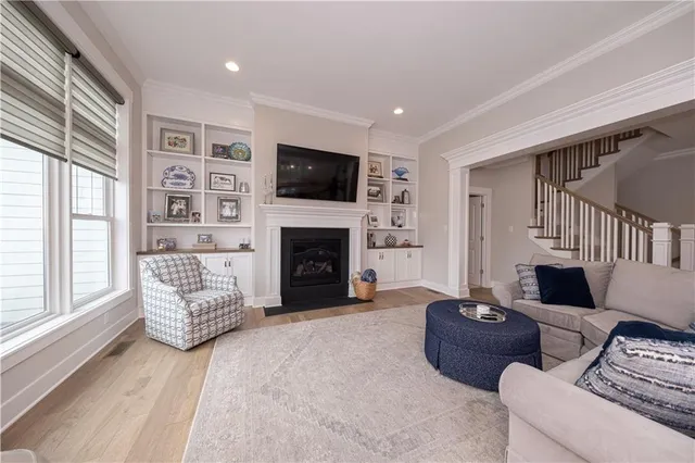 a living room with furniture fireplace and flat screen tv