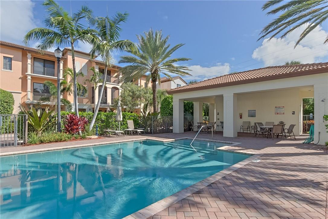 80 Northwest Alcott Circle Boca Raton, FL 33432 - Photo 44 of 51 Large pool with paved sun deck